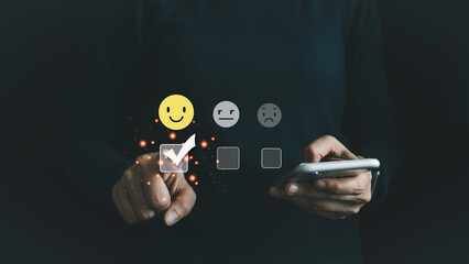 Customer satisfaction concept, thumbs up rating on smile face icon, giving the highest score, very...
