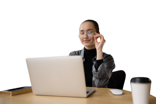 An employee programmer uses a laptop computer in the workplace. A business woman in business clothes looks at the screen.