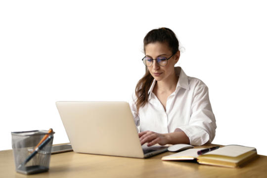 A female freelance marketer for online work uses a laptop, sits at a desk in the office.
