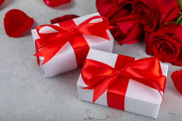 Valentine's Day concept.Valentine's Day background. Gifts, candles, confetti, envelope - postcard, candy, glasses, wine and a bouquet of roses on a colored background. Flatley.Valentine's day celebrat