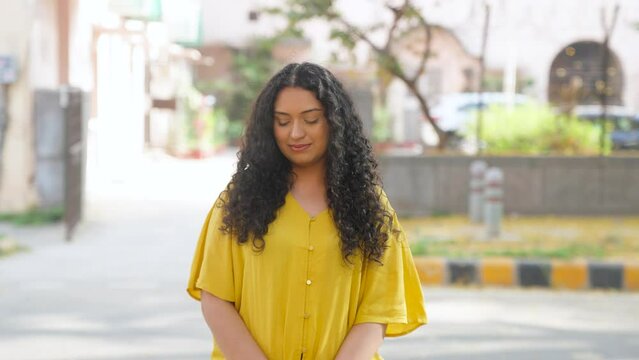 Shy Indian Girl with Curly Hair