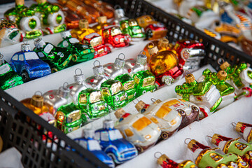 European Christmas market stall in  Old Town. colorful Christmas ornaments are some of the most popular souvenirs with tourists at seasonal fairs.