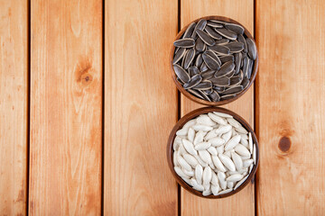 Pumpkin seeds with sunflower seeds in bowl,top view