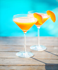 Champagne glasses with peach Bellini cocktail
