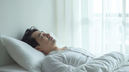 mature Asian man in serene repose, embracing the comfort of a white bed and soft pillow. - Powered by Adobe