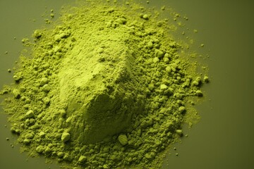  a pile of green powder sitting on top of a green table next to a piece of green stuff on top of a green table top of a green surface next to a green object.
