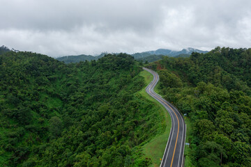 The road is similar to the number 3, This road is built on a mountain, past the forest in Nan Province of Thailand.