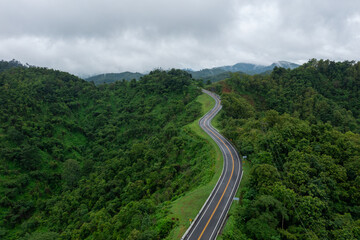 The road is similar to the number 3, This road is built on a mountain, past the forest in Nan Province of Thailand.