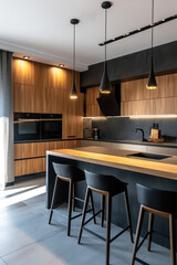 cuisine aménagée moderne composée de bois naturel et béton avec des éclairage suspendu de type spot