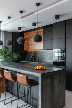 cuisine am&eacute;nag&eacute;e moderne compos&eacute;e de bois naturel et b&eacute;ton avec des &eacute;clairage suspendu de type spot