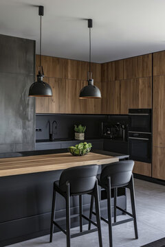 cuisine am&eacute;nag&eacute;e moderne compos&eacute;e de bois naturel et b&eacute;ton avec des &eacute;clairage suspendu de type spot
