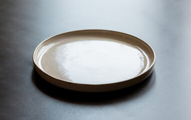 Empty White Plate on Black Wooden Table - Minimalist Dining Setting