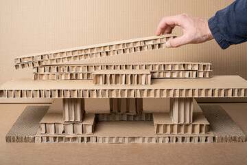 Basic architectural cardboard house model in three dimensions made from the recycled paper...