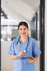 Portrait of healthcare professional holding medical lab patient health check form at hospital.