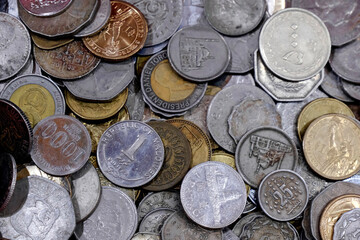 Indian Old vintage coins, vintage coin abstract with English & Indian coins in forefront.