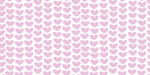 Seamless abstract pattern of small pink hearts on white background. Love backdrop, cute texture for textile, wrapping paper, Valentine's day.