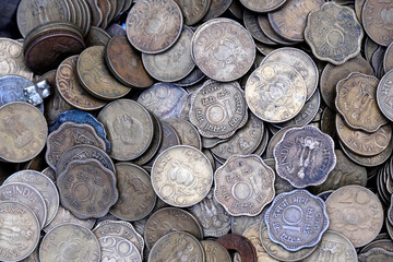 Indian Old vintage coins, vintage coin abstract with English & Indian coins in forefront.