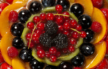 fruit tart, typical dessert made with shortcrust pastry and mixed fresh fruit - above