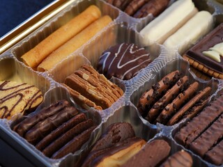 A close-up shot of a box of different kinds of cookies