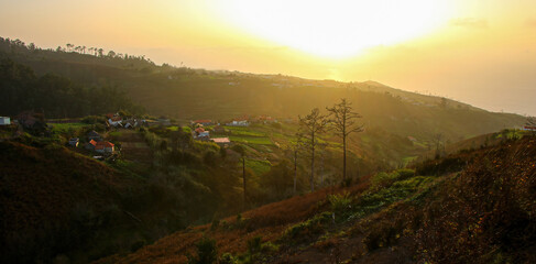 Hillside farming in Achadas da Cruz, a countryside village on the western coast of Madeira island (Portugal) at sunset