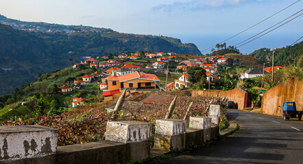 Hillside traditional houses in Santana, a village on the north coast of Madeira island (Portugal) in the Atlantic Ocean