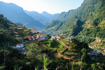 Hillside traditional houses in Boaventura, a village in a valley of the north coast of Madeira...