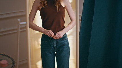 Weight loss female zip jeans closeup. Unhappy woman looking mirror reflection