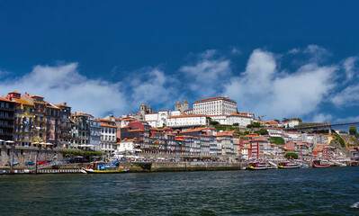 Fototapeta na wymiar Overview of the Cais da Ribeira, the port district, with its colorful houses and cobbled streets, is one of the most characteristic places in Porto.