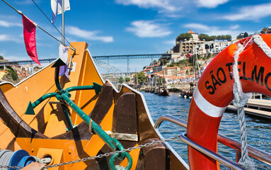 Navigation on the Douro river, in the background the Luis I Bridge, one of the symbols of the city...