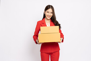 Happy Asian businesswoman in red suit holding package parcel box isolated on white background, Delivery courier and shipping service concept