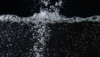 Fotobehang soda water bubbles splashing underwater against black background cola liquid texture that fizzing and floating up to surface like a explosion in under water for refreshing carbonate drink concept © Katherine