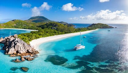 aerial pano of grand anse beach at la digue island in seychelles white sandy beach with blue ocean lagoon and catamaran yacht moored - obrazy, fototapety, plakaty