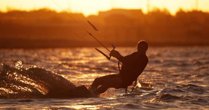 In rays of setting sun, kitesurfer enjoys freedom and excitement of kiteboarding, feeling rush of adrenaline with every movement. Freelancing as way of life gives you freedom to choose your hobbies.