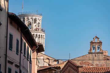 Famous leaning tower of Pisa, residential houses in front