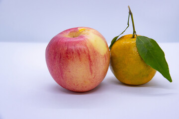 Apple and Orange Tangerine in an isoalted white background