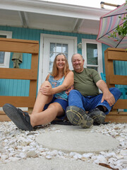 senior adult couple sitting on porch