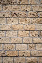 Obraz premium Vertical stone wall texture, masonry wall texture background, fragment of a shell wall