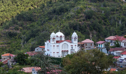 Beautiful white Byzantine church of the Holy Cross in the village of Pedoulas. Nicosia district in Cyprus.