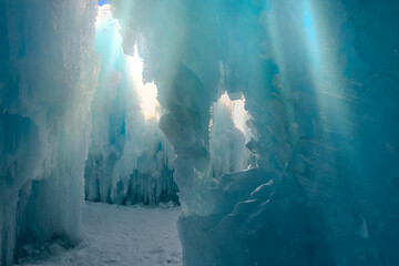 View from below through ice caves with sun shining above. Underneath