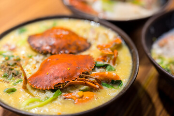 Seafood congee bowl with crab in restaurant