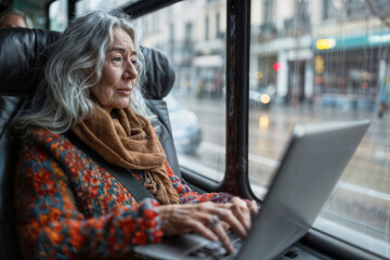 Fototapeta premium Senior Woman Working on Laptop in Bus. Generative AI