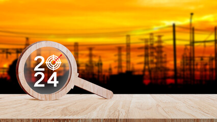 2024 year number with Target icon inside the wooden magnifying glass on industry background,...