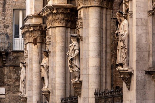 Facade of the medieval Logia della Mercanzia with statues in Siena