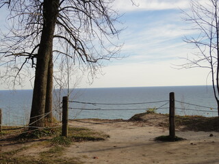 cliff overseeing water with fence
