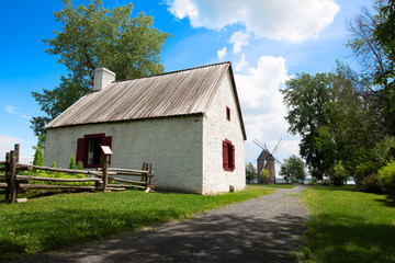 Obraz premium Rural house with windmill