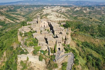 Aerial view of Civita di Bagnoregio, medieval town on top of plateau in Viterbo province, Lazio, Italy - obrazy, fototapety, plakaty