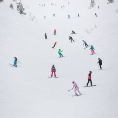 Skiers and snowboarders ski in the Carpathians.