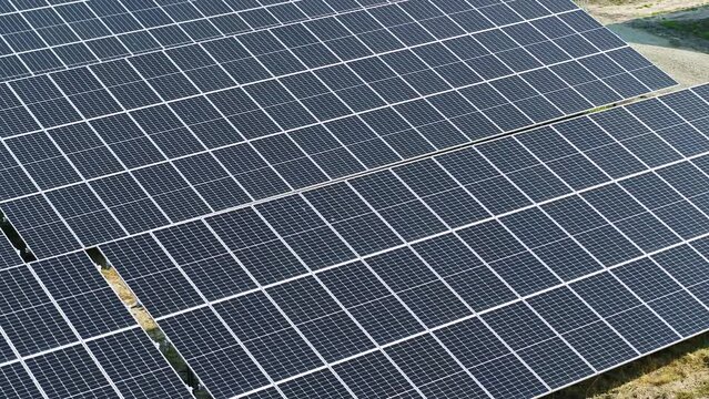 Drone shot of solar panels in Germany. drone pan down.