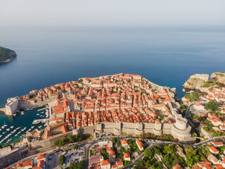 Aerial establishing shot of old town of Dubrovnik, Dalmatia, Croatia. Medieval city fortress on the coast of Adriatic sea. Drone view. Travel destination