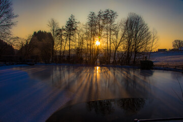 Sonnenaufgang am Teich